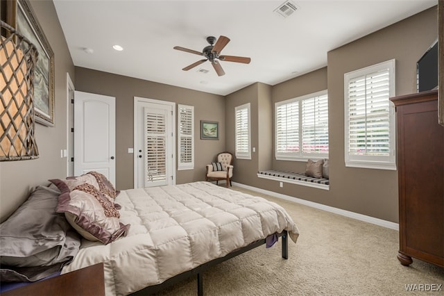 bedroom featuring visible vents, baseboards, ceiling fan, carpet, and access to outside