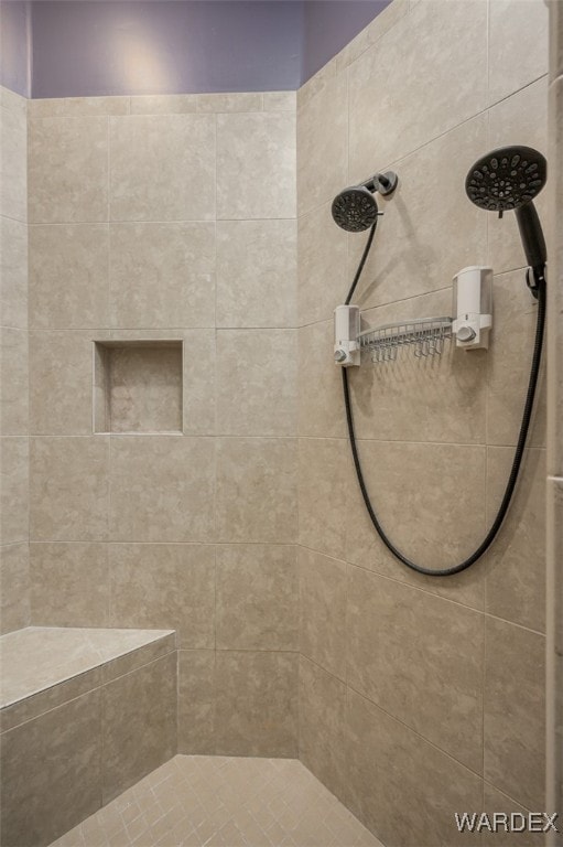 full bathroom featuring a tile shower