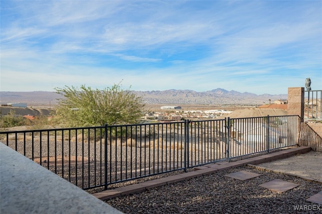 exterior space featuring a fenced backyard and a mountain view