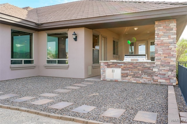 view of patio / terrace featuring fence