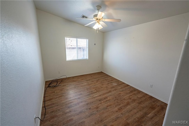 unfurnished room featuring wood finished floors, a ceiling fan, and lofted ceiling