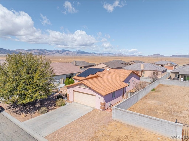 birds eye view of property with a mountain view and a residential view