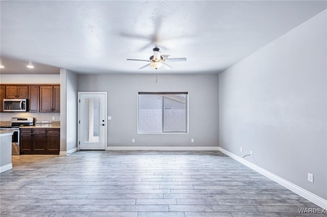 unfurnished living room with light wood-style flooring, baseboards, a ceiling fan, and recessed lighting