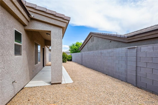 view of yard with a patio area and a fenced backyard