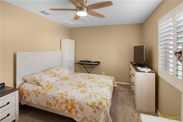 bedroom featuring a ceiling fan, carpet flooring, visible vents, and baseboards