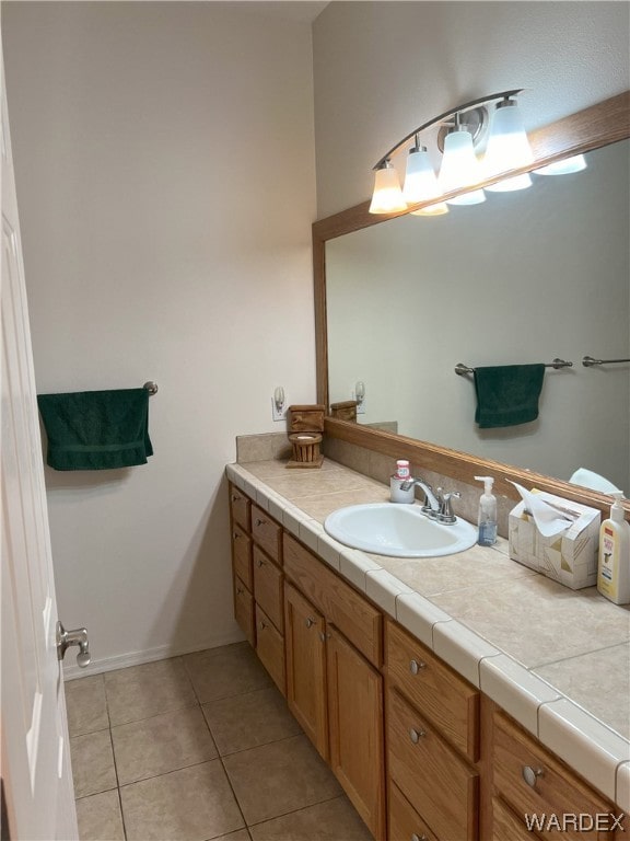 bathroom with tile patterned flooring and vanity