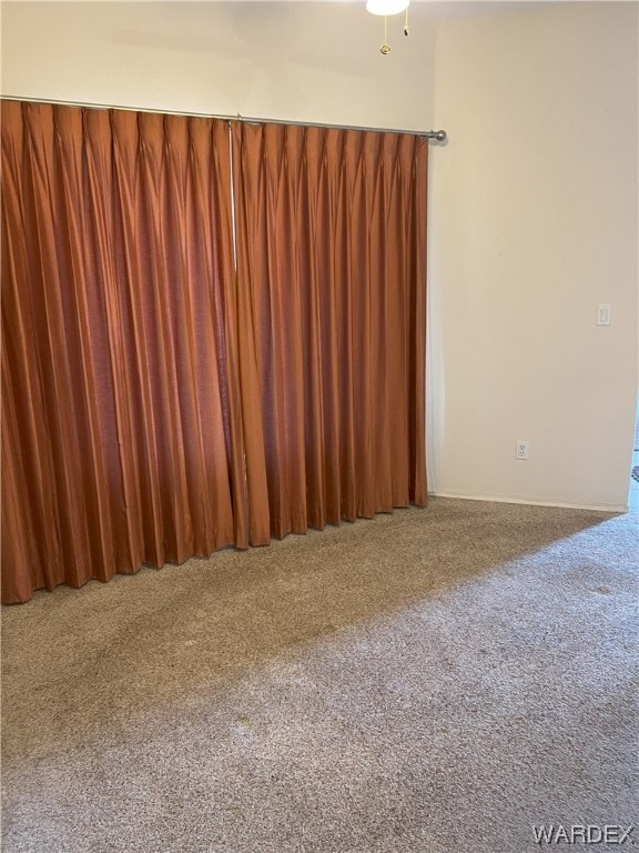 empty room with carpet flooring