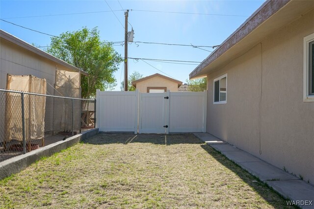 view of yard with a gate and fence