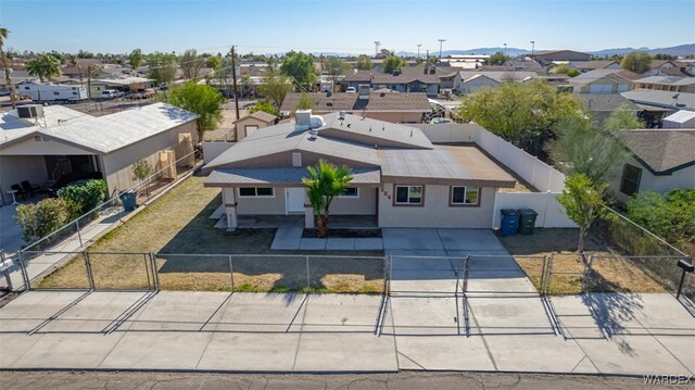 birds eye view of property with a residential view