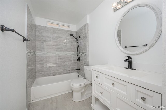 full bathroom with toilet, vanity, and bathing tub / shower combination