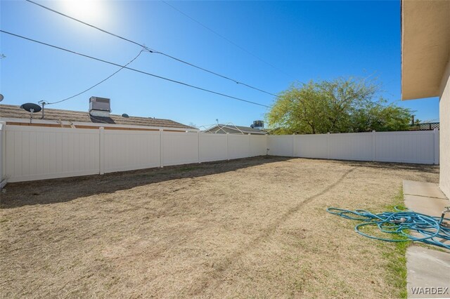 view of yard with a fenced backyard