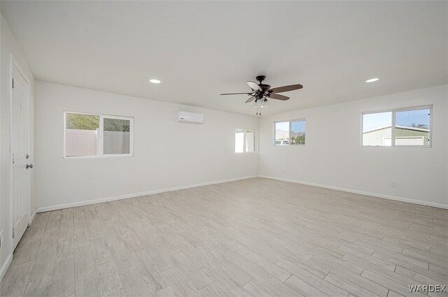 unfurnished room featuring recessed lighting, baseboards, and light wood finished floors