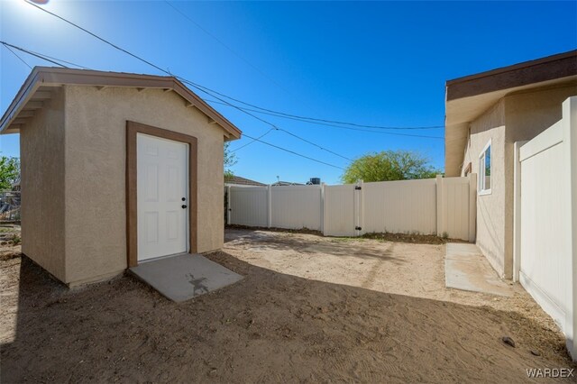 view of yard featuring fence and a gate