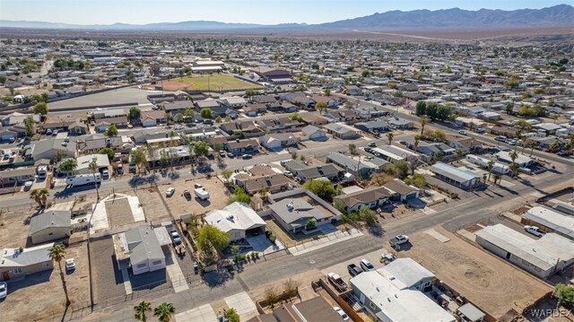 drone / aerial view with a residential view and a mountain view