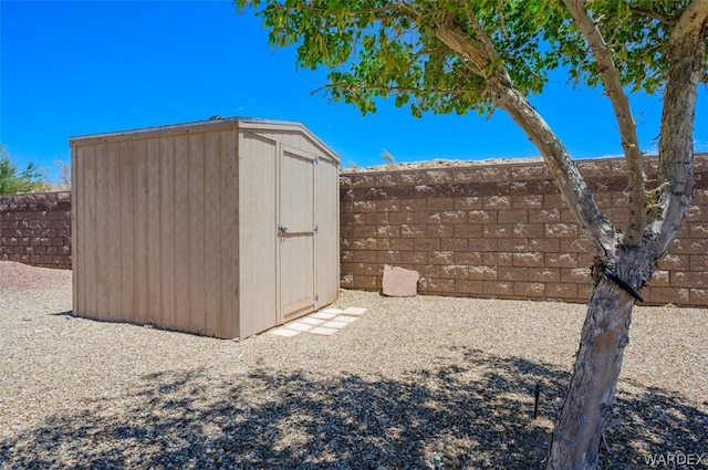 view of shed with fence