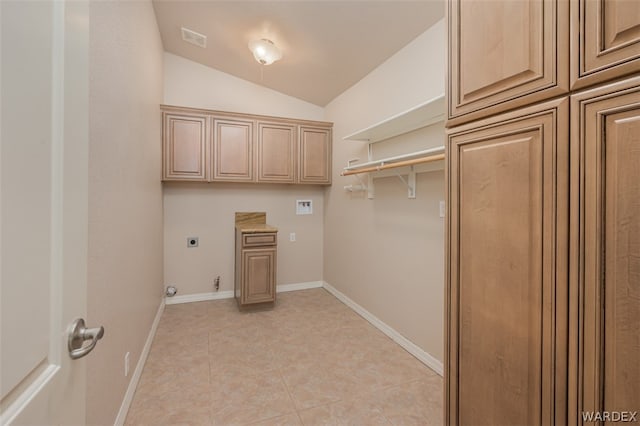 laundry area featuring cabinet space, visible vents, hookup for an electric dryer, light tile patterned flooring, and baseboards