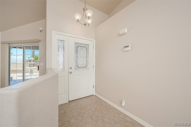 foyer with baseboards, vaulted ceiling, an inviting chandelier, and light tile patterned floors