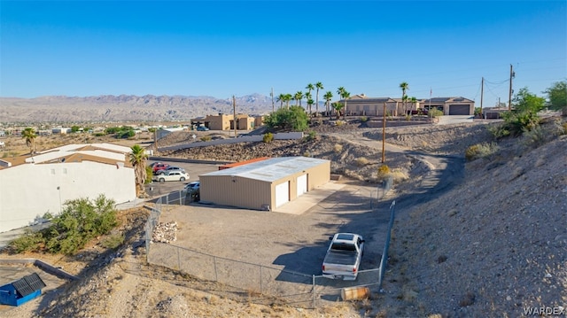 birds eye view of property featuring a mountain view