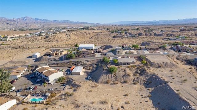 bird's eye view featuring a residential view, view of desert, and a mountain view