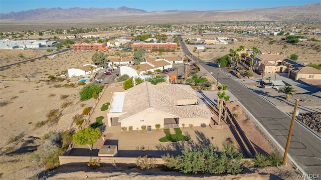 drone / aerial view featuring a residential view and a mountain view