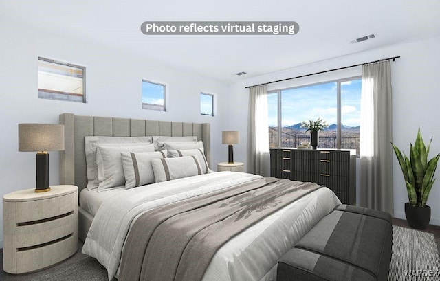 bedroom featuring visible vents and a mountain view