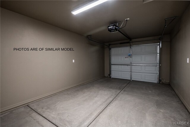 garage featuring baseboards and a garage door opener