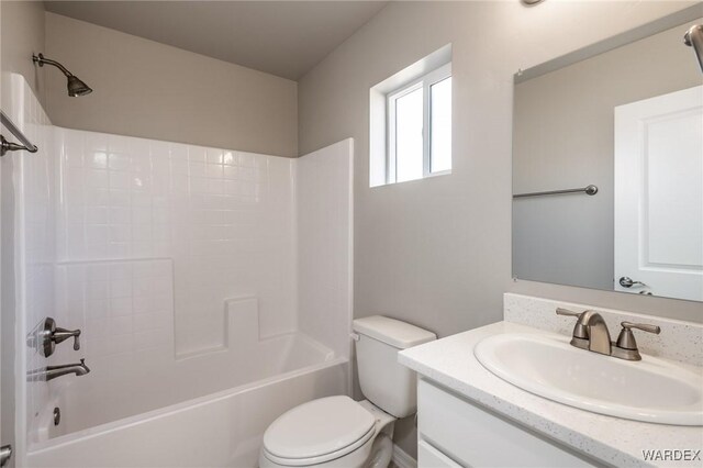 full bath featuring toilet, shower / bathtub combination, and vanity