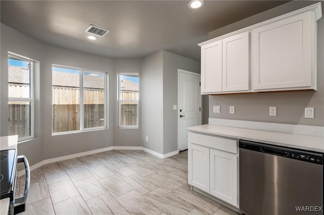 kitchen with visible vents, a healthy amount of sunlight, light countertops, and stainless steel dishwasher