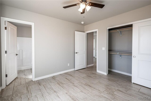 unfurnished room with baseboards, visible vents, and a ceiling fan