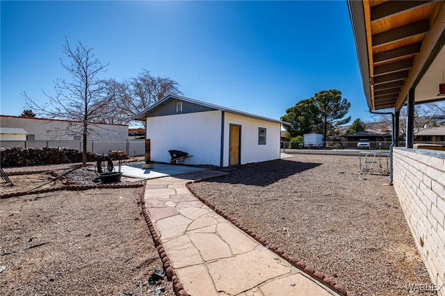 view of outbuilding with fence