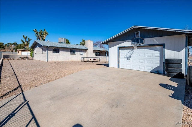 exterior space featuring an outdoor structure and fence