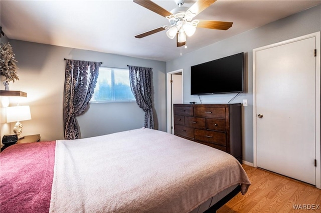 bedroom featuring light wood-type flooring and ceiling fan