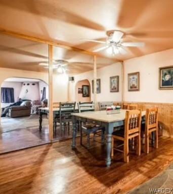 dining area with a ceiling fan and wood finished floors