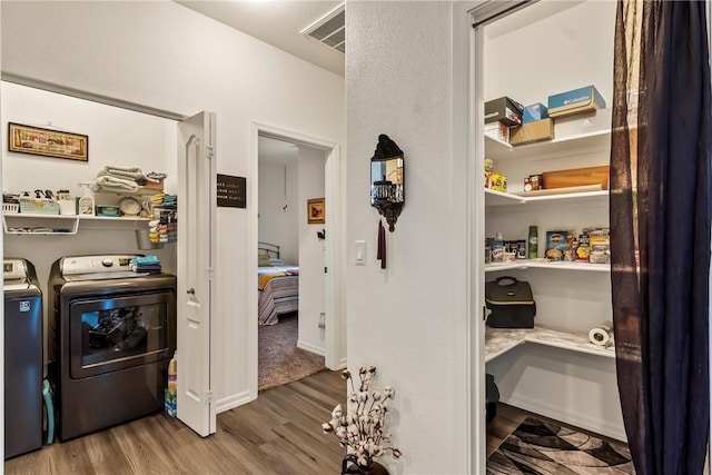 2602 Bear Mountain Loop, Bullhead City, AZ 86442 - laundry area with wood finished floors, washing machine and clothes dryer, and an office area
