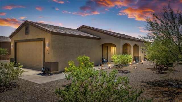 2602 Bear Mountain Loop, Bullhead City, AZ 86442 - view of front of property with a garage, stucco siding, and driveway