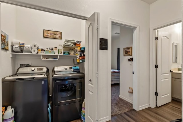 2602 Bear Mountain Loop, Bullhead City, AZ 86442 - laundry area with washing machine and dryer, wood finished floors, and baseboards