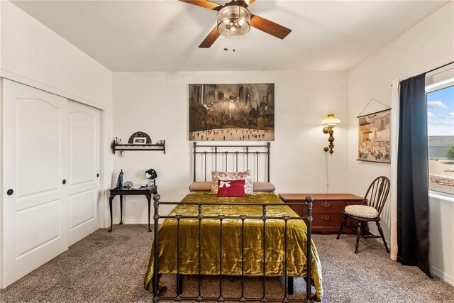 2602 Bear Mountain Loop, Bullhead City, AZ 86442 - bedroom with carpet flooring, a closet, baseboards, and a ceiling fan