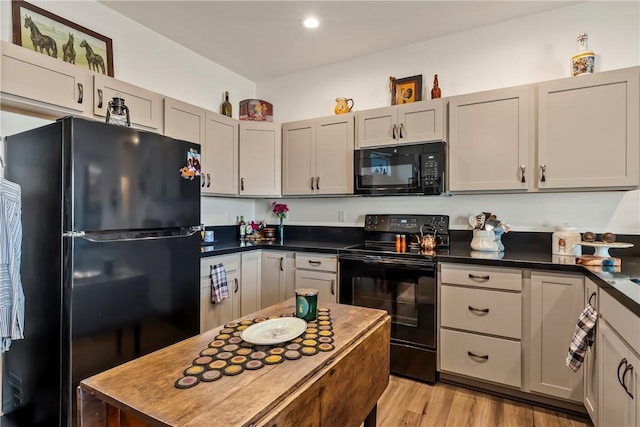 2602 Bear Mountain Loop, Bullhead City, AZ 86442 - kitchen with black appliances, dark countertops, light wood-style floors, and recessed lighting