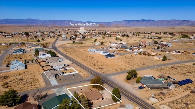 bird's eye view featuring view of desert, a mountain view, and a residential view