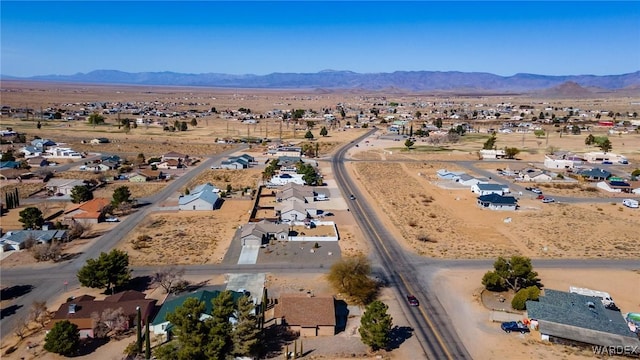 bird's eye view featuring view of desert, a mountain view, and a residential view