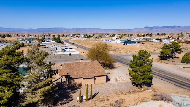 bird's eye view featuring a residential view, a mountain view, and a desert view