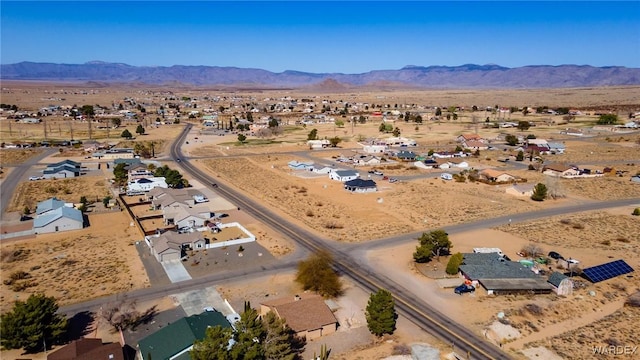 bird's eye view featuring view of desert, a mountain view, and a residential view