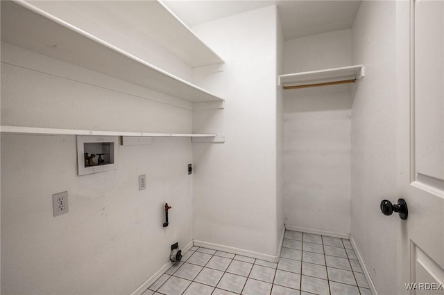 laundry room featuring washer hookup, light tile patterned floors, baseboards, hookup for an electric dryer, and laundry area