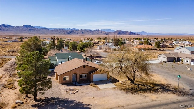 drone / aerial view with a mountain view and a residential view