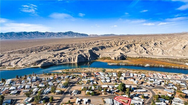 birds eye view of property featuring a residential view and a water and mountain view