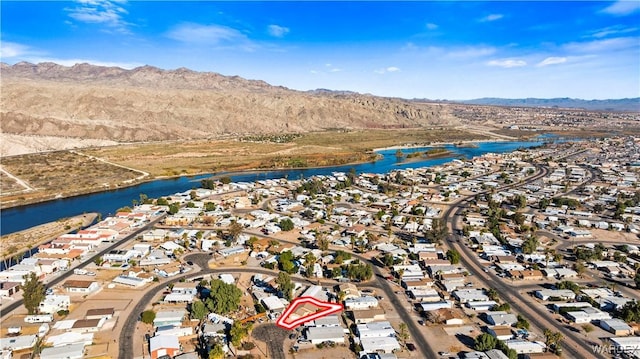 bird's eye view with a residential view and a water and mountain view