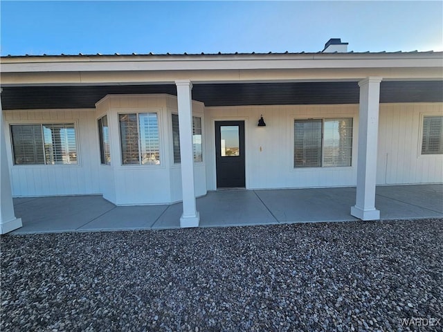 doorway to property with a patio