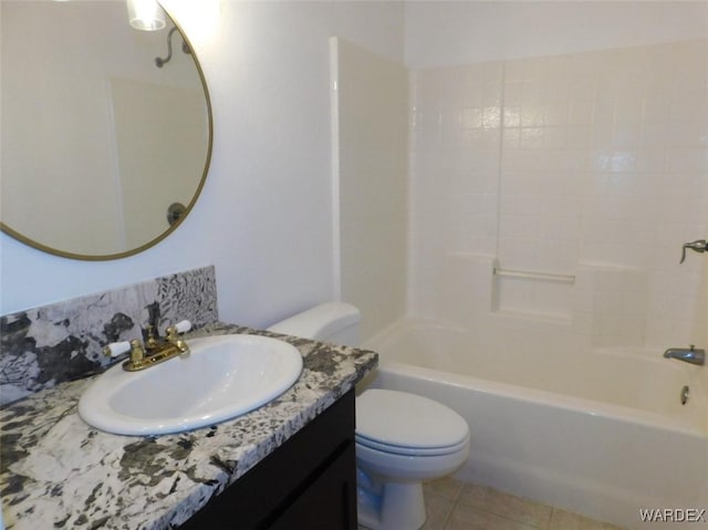 bathroom with shower / bathing tub combination, vanity, toilet, and tile patterned floors