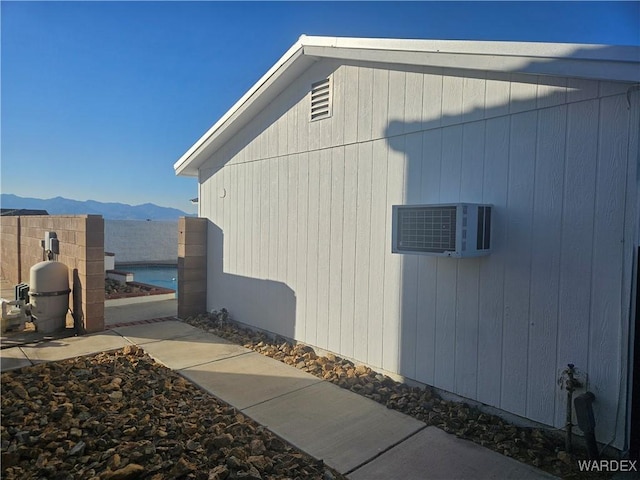 view of side of property with a mountain view