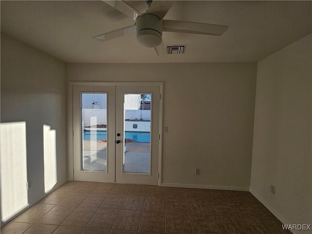 doorway with french doors, visible vents, a ceiling fan, baseboards, and tile patterned floors